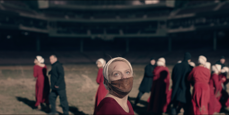 Offred looks over the staging area for her impending execution.